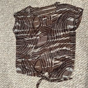 Short sleeve t-shirt with wild print and wood embellishment with key hole neck.